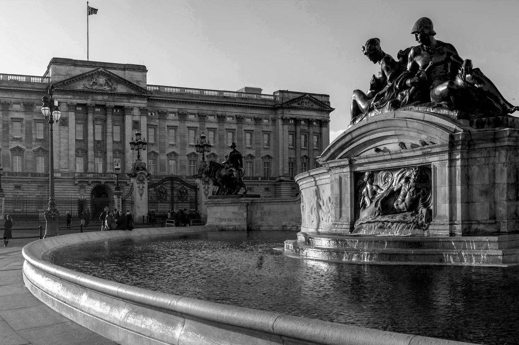Luxury vehicle parked near a UK landmark offering bespoke private tour experiences with a personal touch.
